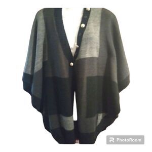 - Acrylic and wool blend batwing style sweater with accent buttons